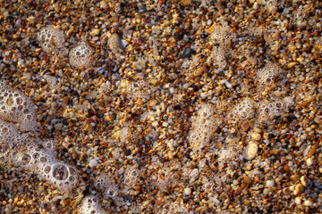 sea pebbles colored granite on the beach