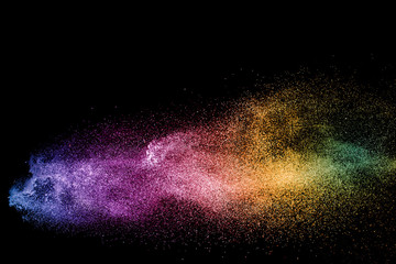abstract colored dust explosion on a black background.abstract powder splatted background,Freeze...