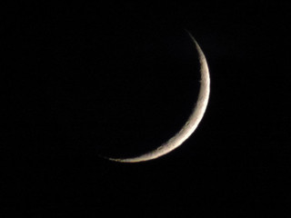 Fototapeta na wymiar Crescent moon in the dark night sky.