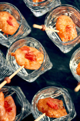close-up canape with shrimp in glass soft background