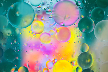 Colorful artistic image of oil drop on water for modern and creation design background.