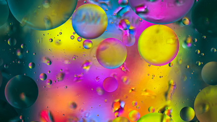 Colorful artistic image of oil drop on water for modern and creation design background.