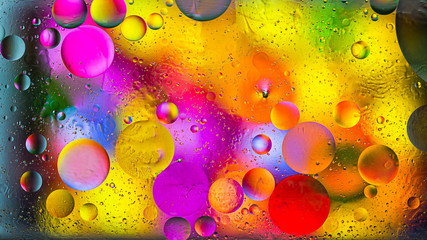 Colorful artistic image of oil drop on water for modern and creation design background.