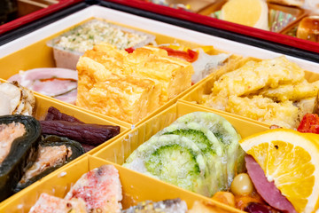 boxes with New Year dishes japanese food (osechi)