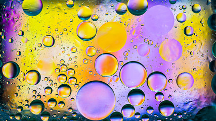 Colorful artistic image of oil drop on water for modern and creation design background.