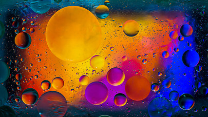 Colorful artistic image of oil drop on water for modern and creation design background.