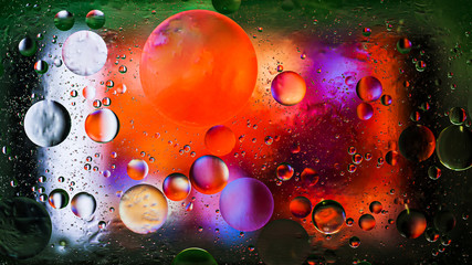 Colorful artistic image of oil drop on water for modern and creation design background.