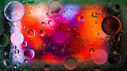 Colorful artistic image of oil drop on water for modern and creation design background.