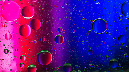 Colorful artistic image of oil drop on water for modern and creation design background.