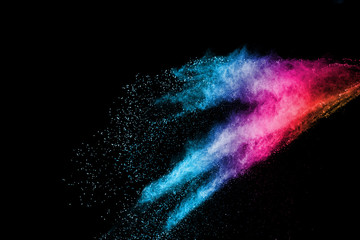 abstract colored dust explosion on a black background.abstract powder splatted background,Freeze...