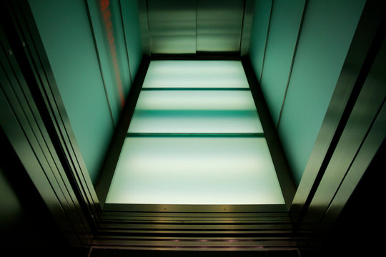 Open elevator door of descending elevator
