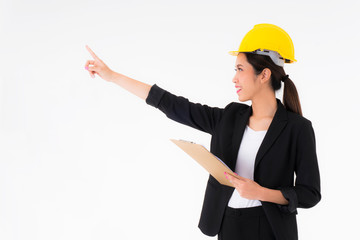 Asian young engineer women Yellow Safety helmet with clipboard and document in hand Construction and architectural industry One hand is pointing out something a copy space isolated on white background
