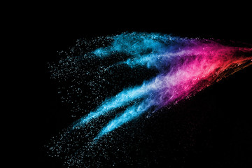 abstract colored dust explosion on a black background.abstract powder splatted background,Freeze...