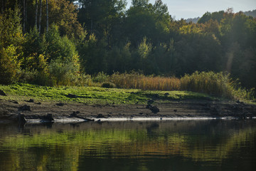 Autumn lake in Kamchatka among the mountains and forests. the nature of Kamchatka