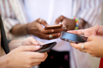 female hands holding mobile phones