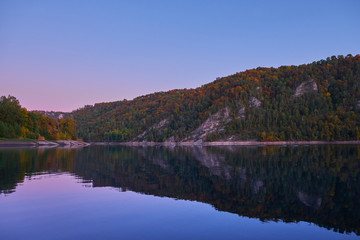 Obraz premium Autumn landscape of lake and mountains at sunset. Sweden