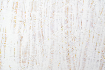 White painted wood texture seamless rusty grunge background, Scratched white paint on plywood chipboard surface made of recycled compressed wood and sawdust.