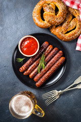 Oktoberfest food - sausage, beer and bretzel.
