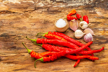 Red and orange chili pepper with garlic cooking food background