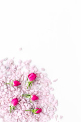 decorative pebble and roses mock-up for design on white background top view