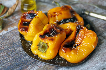 Roasted peppers paprika. Grilled yellow paprika. Autumn dish. Vegan snack. Selective focus. Macro.