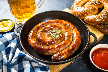 Fototapeta premium Oktoberfest food - sausage, sauerkraut, beer and bretzel.