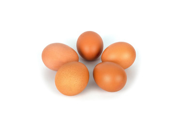 Fresh organic brown eggs isolated in white background