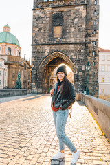 woman portrait at sunrise at charles bridge in prague