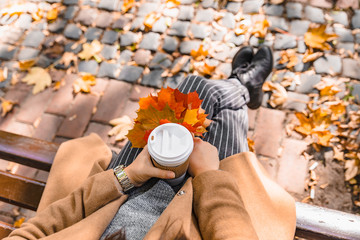 woman holding coffee cup drink to go autumn fall season