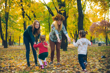 family playing at city park mothers with daughters