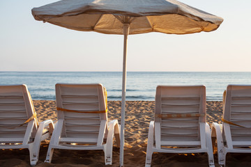 free sun loungers and sunbeds on the beach. bright soft photo