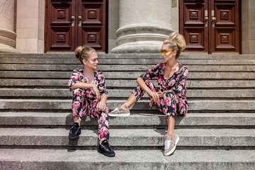 Mother and daughter having fun in same outfits. Fashionable family - Image