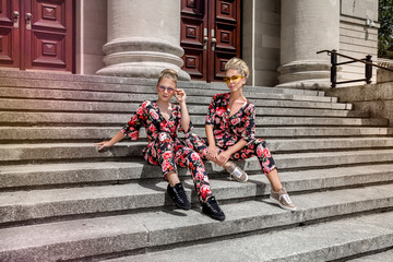 Mother and daughter having fun in same outfits. Fashionable family - Image