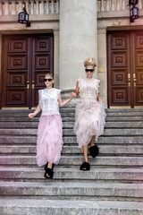 Mother and daughter having fun in same outfits wearing tutu skirts.
