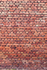 Red bricks background. A part of wall of the building