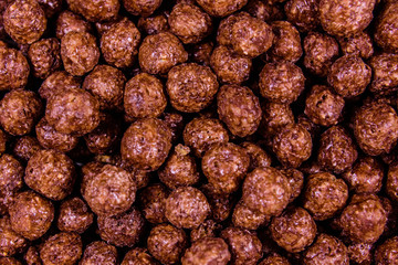 Fototapeta na wymiar Texture of chocolate cereal balls for the background