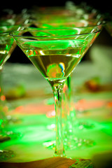 glass of cocktail at party table