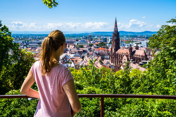 Germany, Stunning blonde woman with ponytail enjoying view above city freiburg im breisgau and...