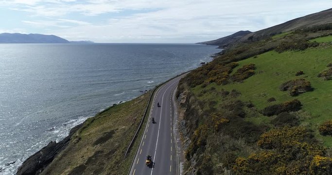 Aerial, coastal motorcycle drive on Dingle Peninsula