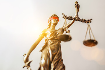 The Statue of Justice - lady justice or Iustitia / Justitia the Roman goddess of Justice with red blindfold, banner size, copyspace for your individual text.