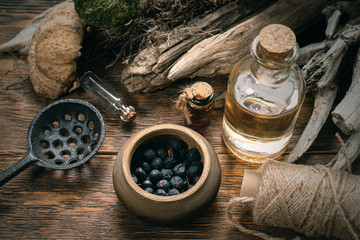 Magic potion bottles on a wizard table. Herbal medicine with dried ingredients on the table...
