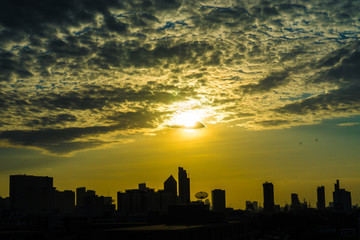 Fototapeta na wymiar Building silhouette sunset colorful sky with cloud
