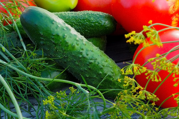 Fresh ecological vegetables on a wooden Board. Various types of useful crops.