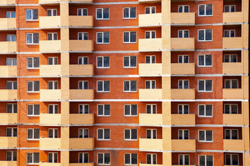 Fototapeta na wymiar High-rise residential building close-up.