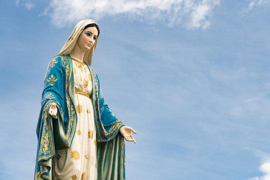 The Blessed Virgin Mary,mother of Jesus on the blue sky, in front of the Roman Catholic Diocese, public place in Chanthaburi, Thailand.