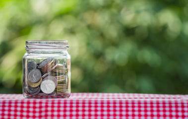 money coin in a glass jar
