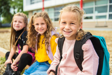 group of kids on the school background having fun