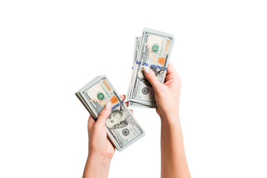 Isolated image of female hands counting dollars on white background. Top view of salary and wages concept