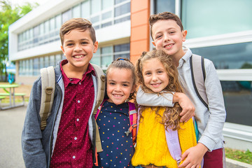 group of kids on the school background having fun