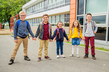 group of kids on the school background having fun